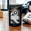 Image shows a bag of Bulldog Spirit Coffee on a wooden countertop.